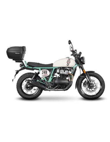 Fijaciones para montar una maleta superior a la moto.